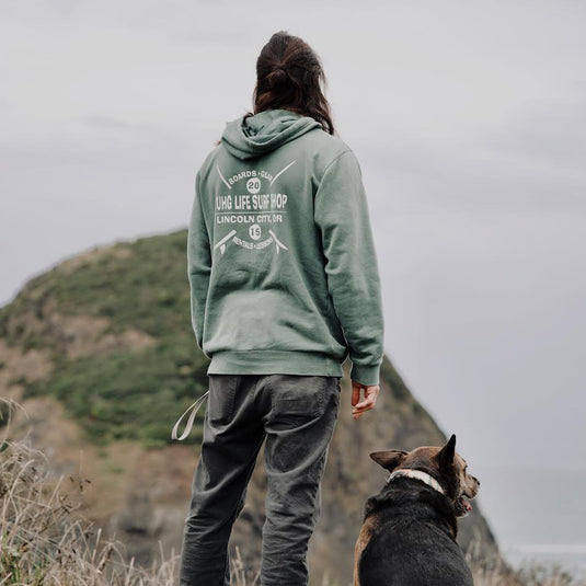 The Rondina Hoodie - Back overlooking a hill and the ocean